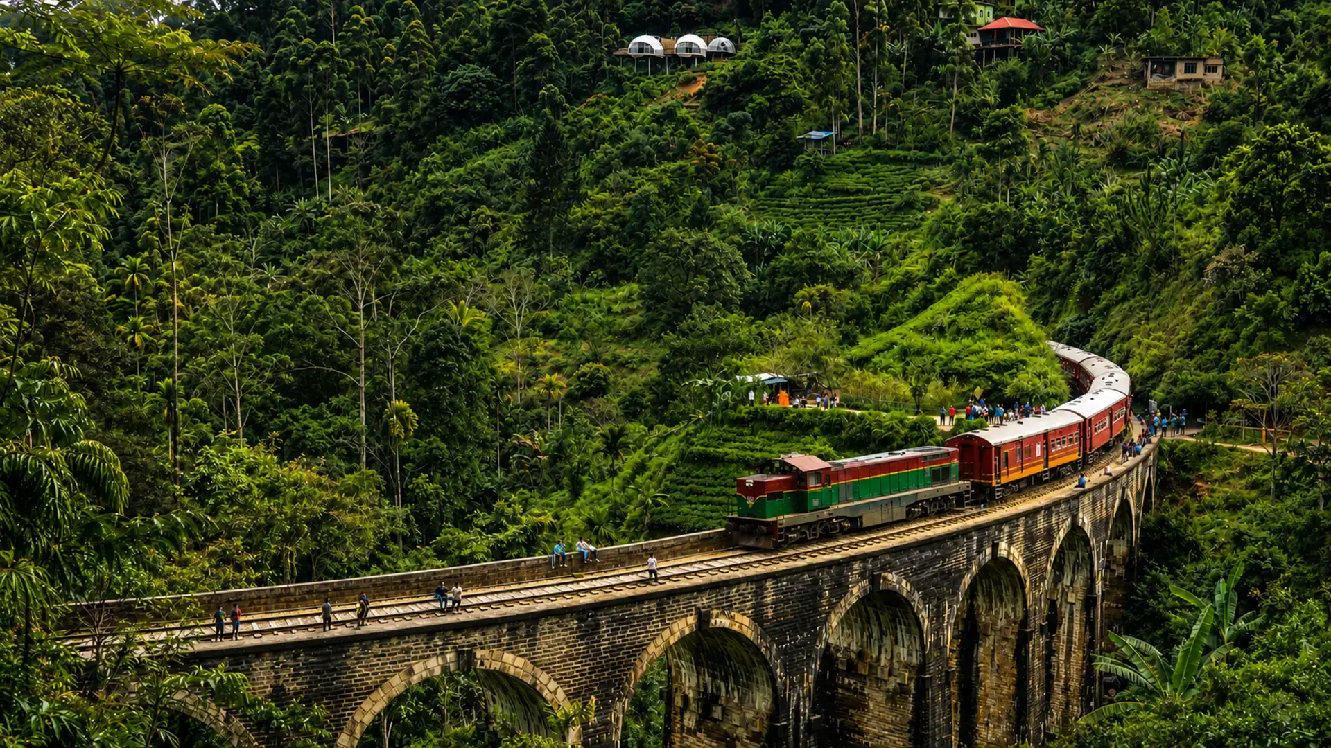 Colourful train crossing the Nine Arch Bridge in Ella, Sri Lanka